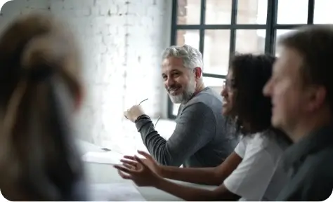 A work team sitting around a table