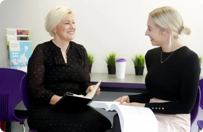 Two office professionals in discussion
