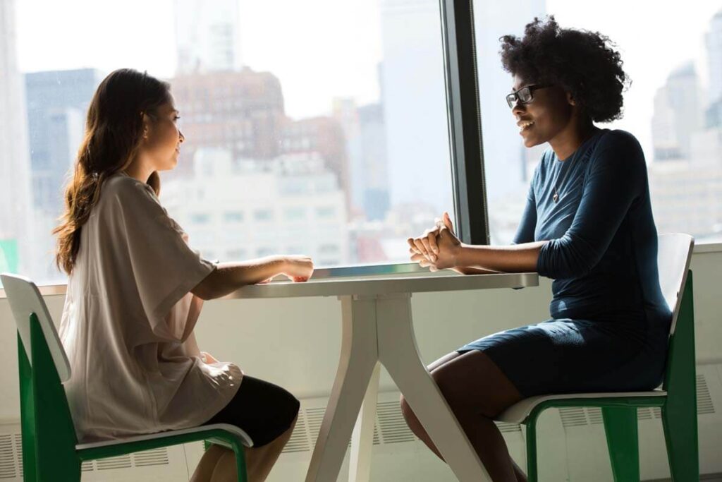 Two professional women talking