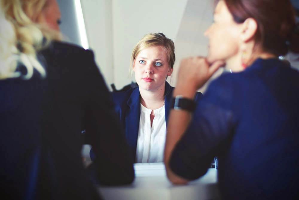 Three women in a meeting