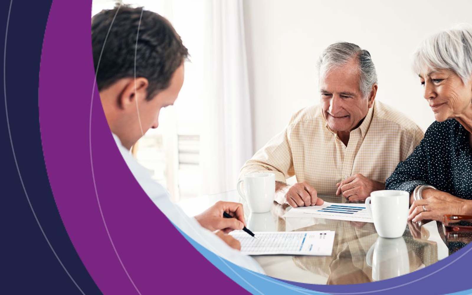 An elderly couple in a meeting